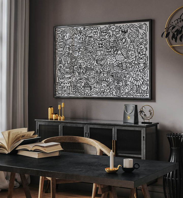 Creature Carnival Doodle Art Painting in Black Plain Frame placed on wall behind a table