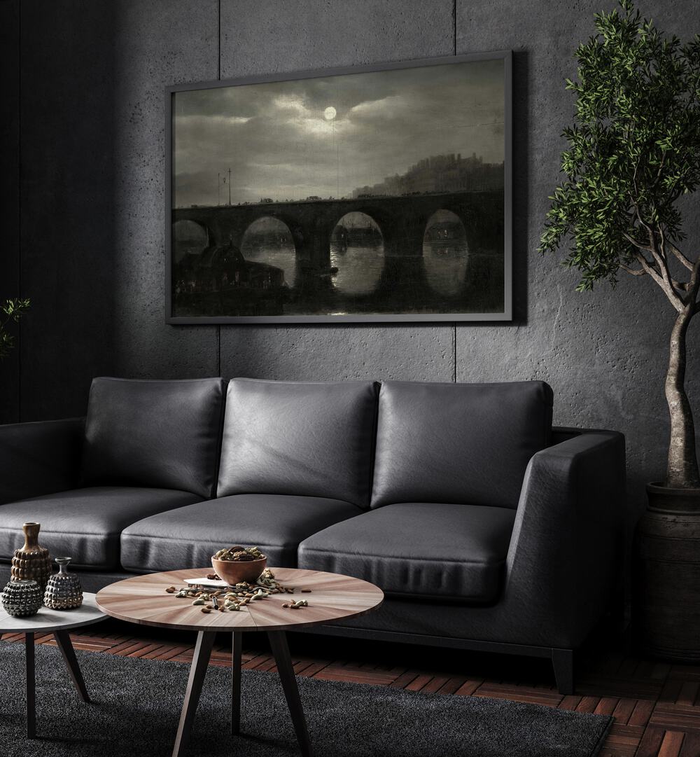 Crescent Cascades Gothic Wall Art Prints in Black Plain Frame hanging on a wall above black leather couch beside a plant.