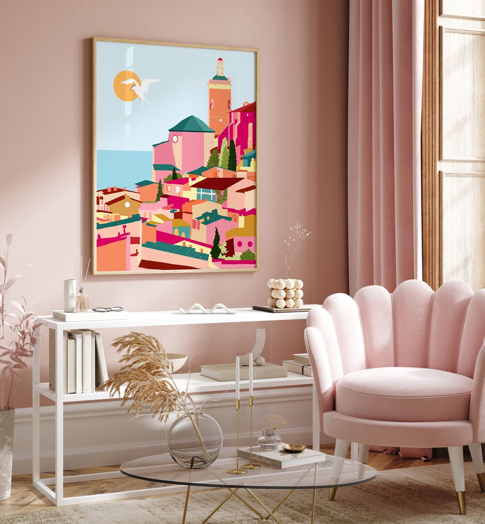 Crimson Rouge By Uma Gokhale Travel Art Prints in Oak Wood Plain Frame on a pink wall above a white table