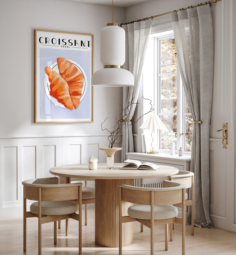 Croissant-Paris Cafe Art Prints Cafe Posters in Oak Wood Plain Frame placed on a White Colored Wall near a Coffee Table in the Dining Room