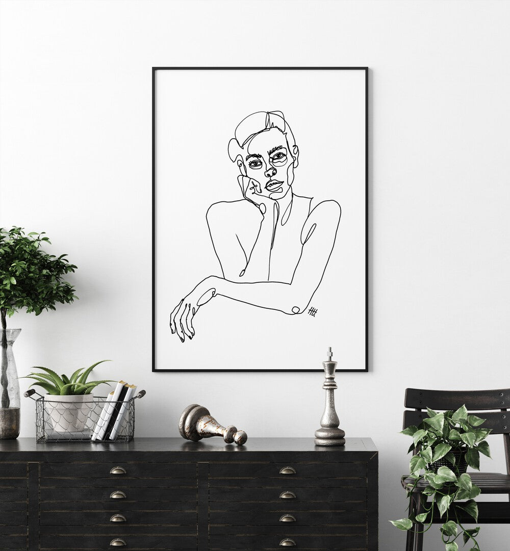 Curious by Hanna Lee Tidd Line Art Paintings Line Art Prints in Black Plain Frame placed on a white wall behind a console table