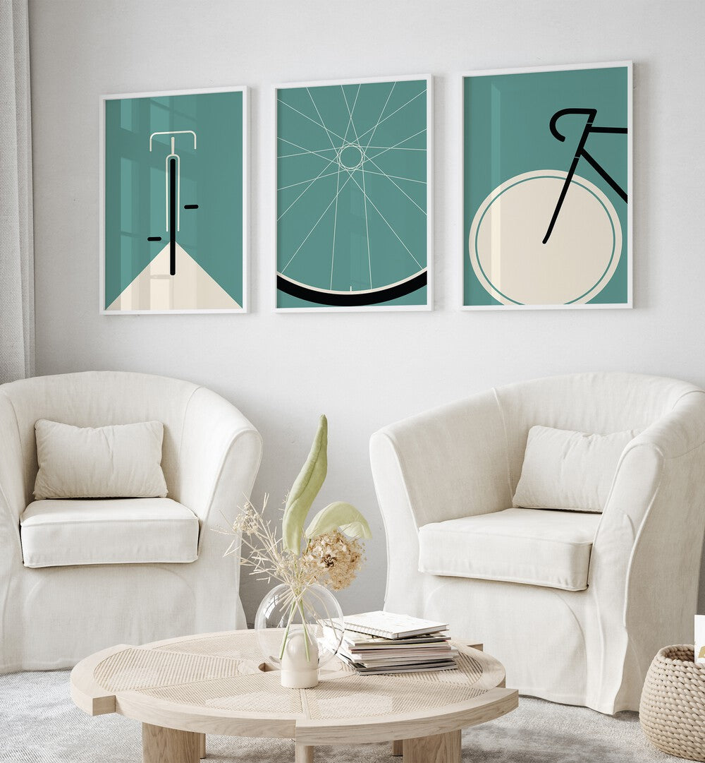 Cycle Set Set Of 3 Paintings in White Plain Frame placed on a living room wall behind a sofa