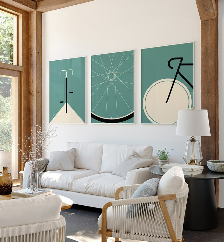 Cycle Set Set Of 3 Paintings in White Plain Frame placed on a living room wall behind a sofa