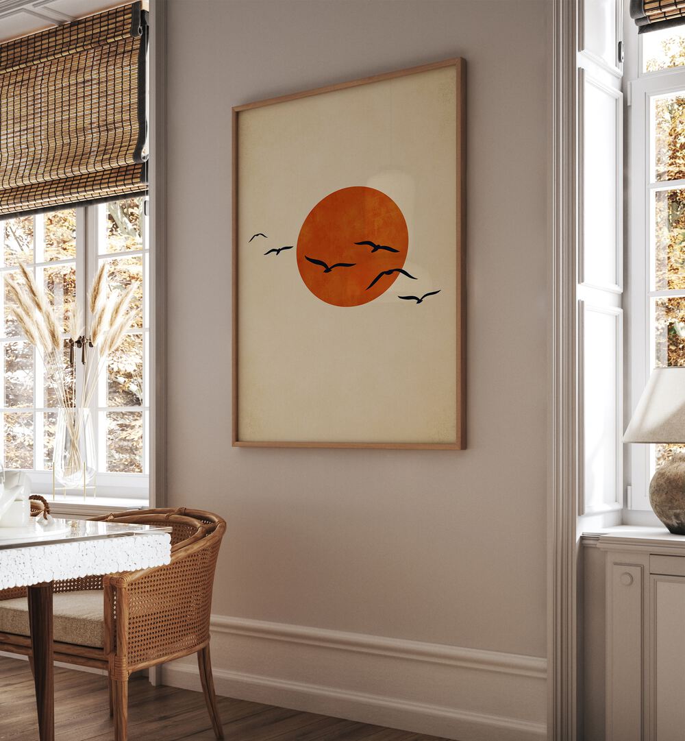 Dancing With The Sun Landscape Art Artwork in Oak Wood Plain Frame on a Cream Colored Wall Near A Dinning Table in the Dinning Room