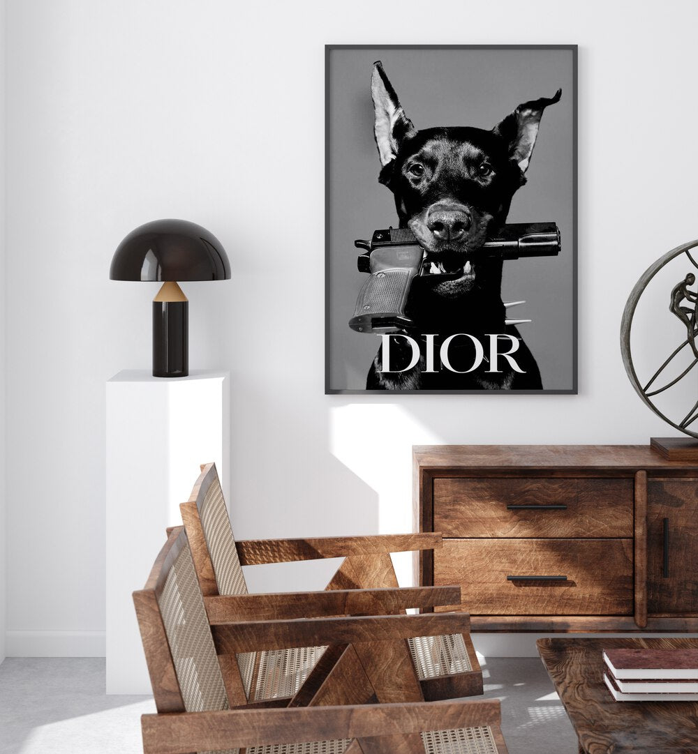 Dior Fashion Art Painting Artwork in plain black frame above a table beside a lamp on a white wall