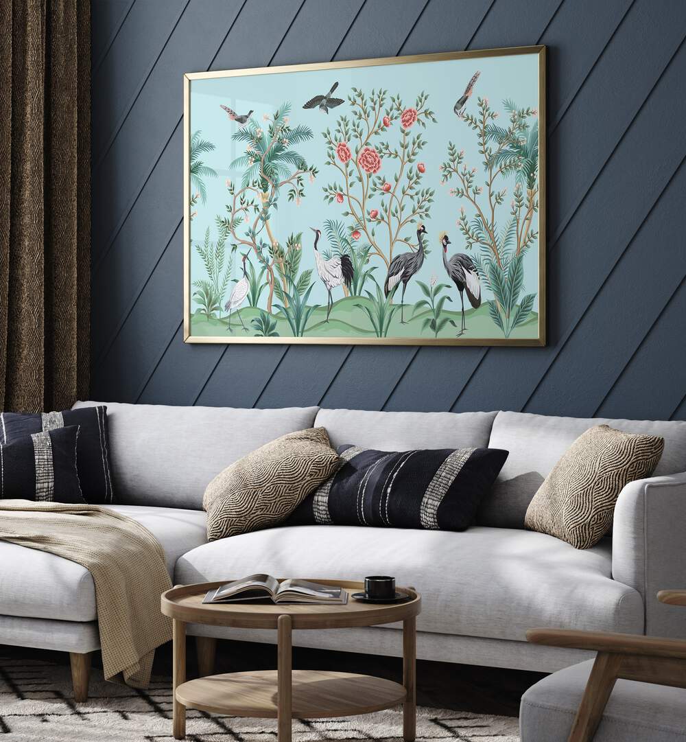 Divine Garden Peacocks Amidst Blooms I Indian Art Painting Artwork in Gold Plain Frame Placed on a Blue Strip Patterned Wall Behind A White Sofa in the Living Room