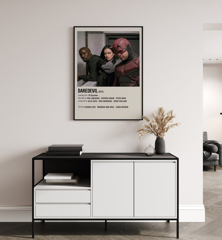 Daredevil Movie Posters in Black Plain Frame placed on a white wall behind a black and white table