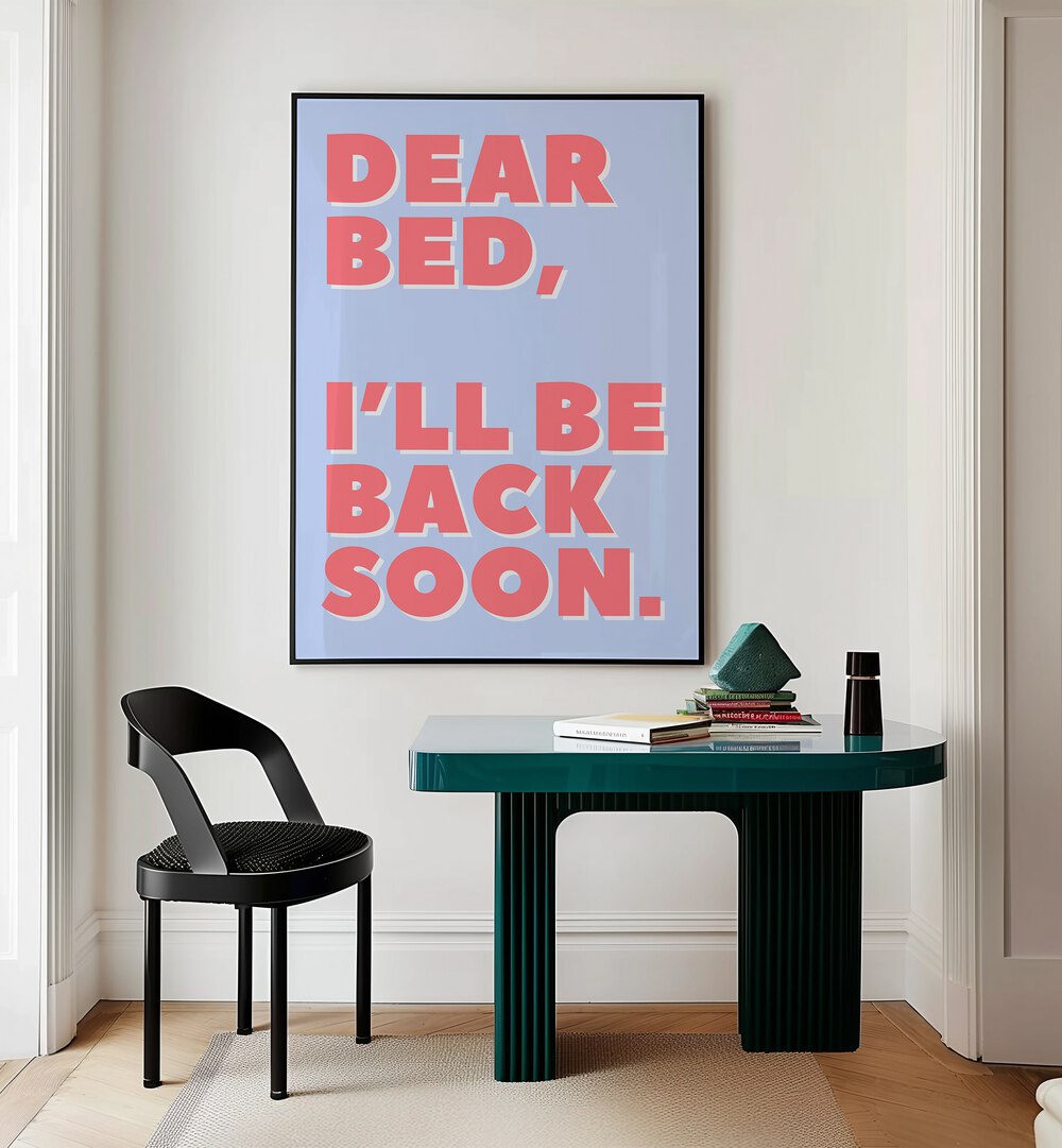 Dear Bed by Athene Fritsch Quotes and Typography Posters in Black Plain Frame placed on a wall behind a study table 