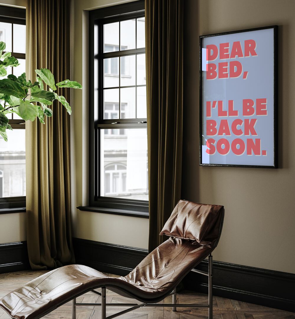 Dear Bed by Athene Fritsch Quotes and Typography Posters in Black Plain Frame placed on a living room wall behind a chair and beside a window