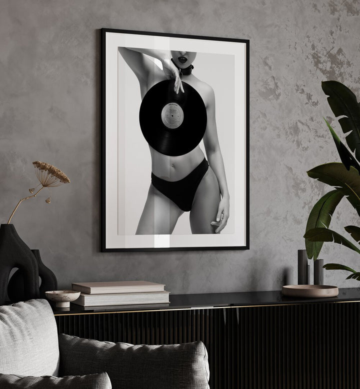 Death Ride by David Drake Fine Art Photography Fashion Photography in Black Frame With Mount placed on a wall behind a console table