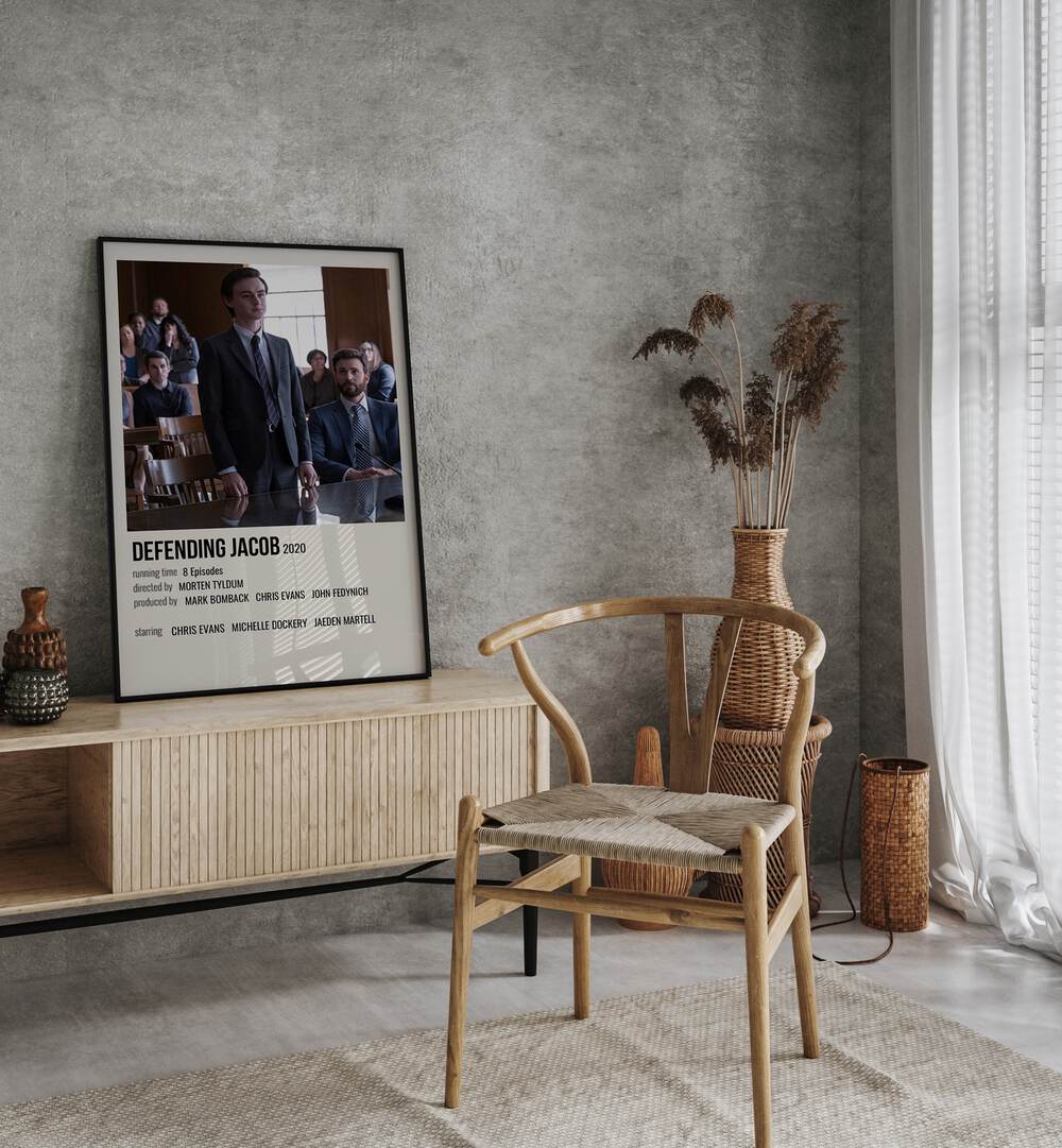 Defending Jacob 2020 Movie Posters in Black Plain Frame placed on a table beside oakwood chair