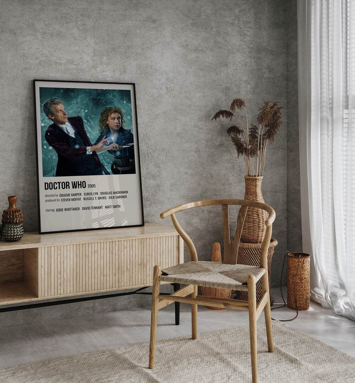 Doctor Who 2005 Movie Posters in Black Plain Frame placed on a table beside oakwood chair