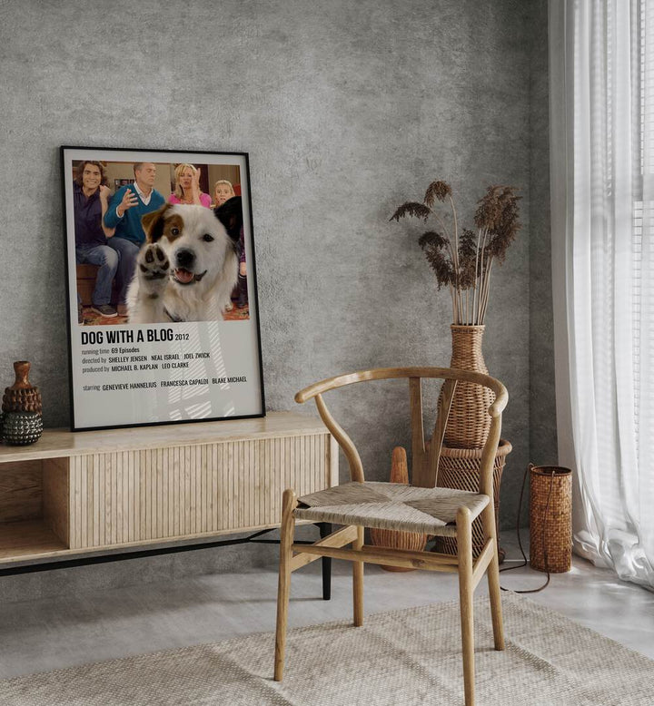 Dog With A Blog 2012 Movie Posters in Black Plain Frame placed on a table beside oakwood chair