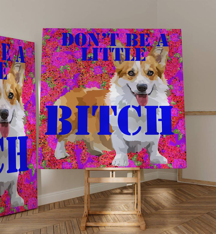 Dont Be a Little Bitch I By Lynnda Rakos Pop Art Paintings Pop Art Prints in Gallery Wrap  placed on a easel stand beside an artwork