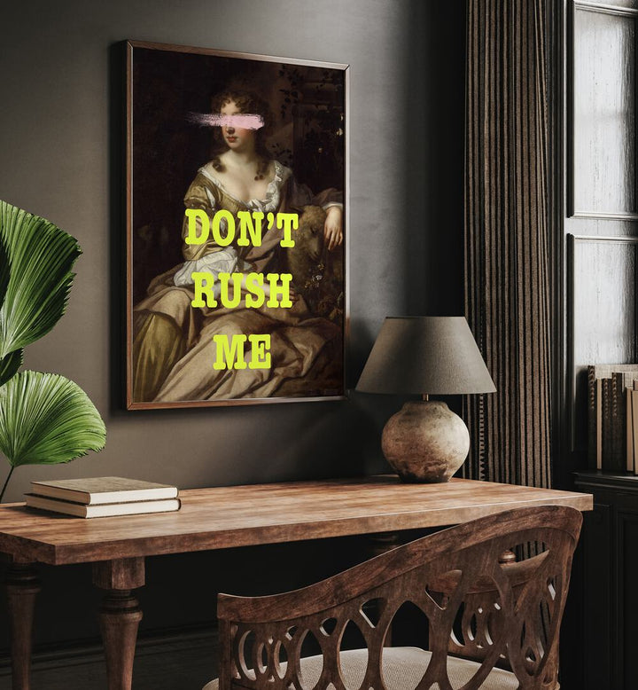 Dont Rush Me I Grace Digital Art Co Altered Art Prints in Dark Wood Plain Frame placed on a wall behind a study table