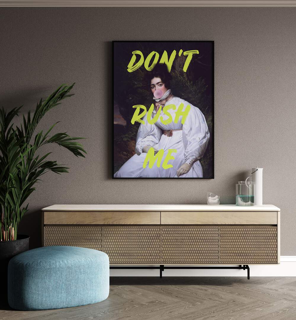 Dont Rush Me II by Grace Digital Art Co Altered Art Prints in Black Plain Frame placed on a wall behind a console table