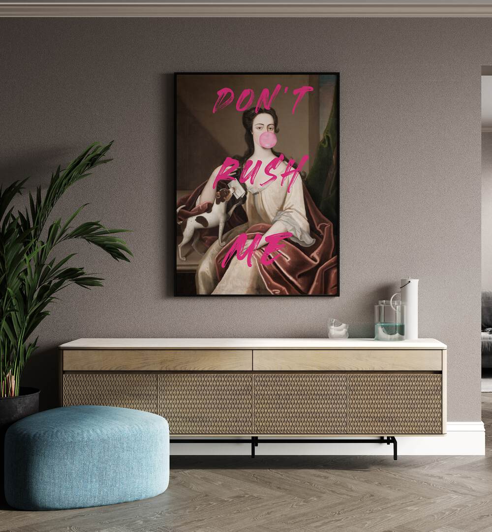 Dont Rush Me III by the Art Concept Altered Art Prints in Black Plain Frame placed on a wall behind a console table