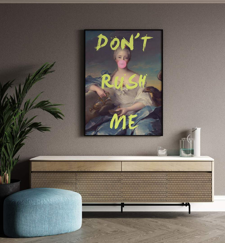 Dont Rush Me V Grace Digital Art Co Altered Art Prints in Black Plain Frame placed on a wall behind a console table and beside a plant