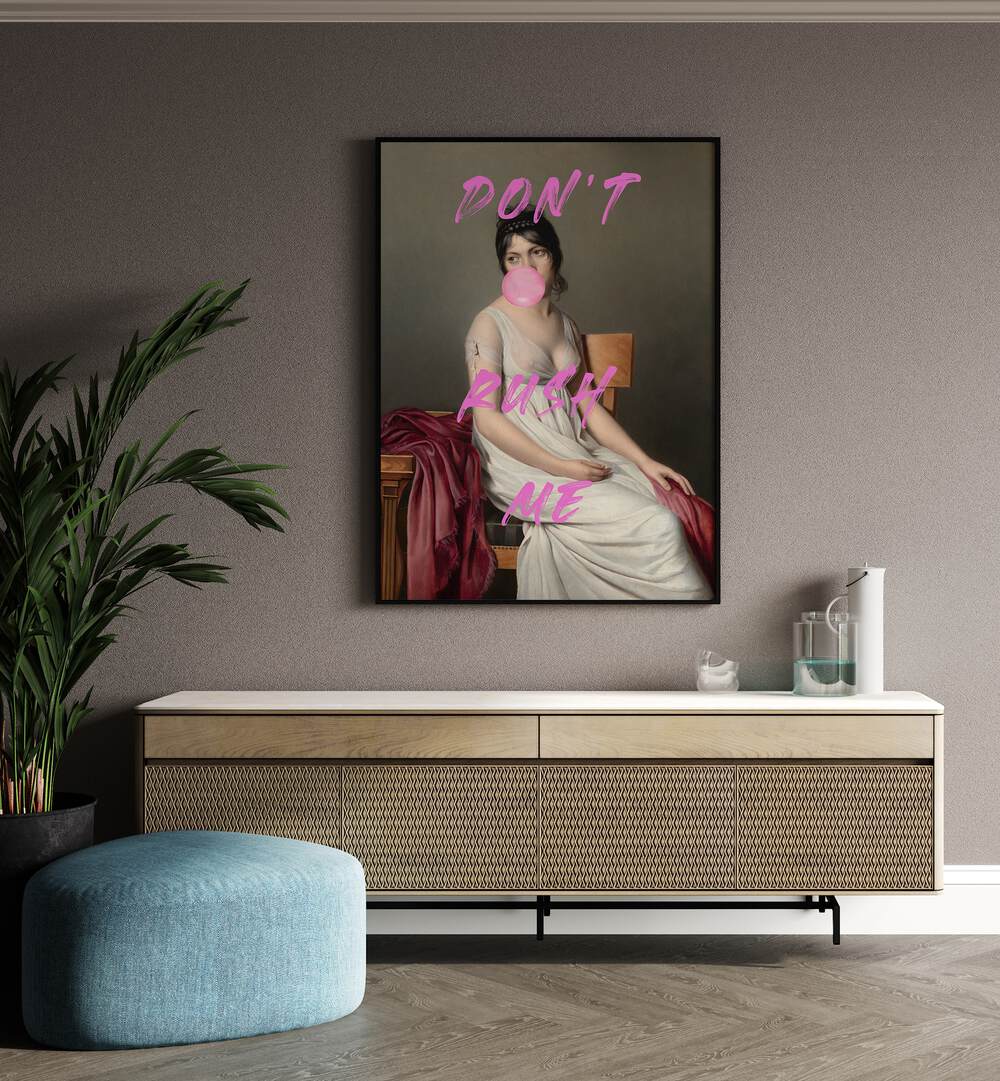 Dont Rush Me VIII by the Art Concept Altered Art Prints in Black Plain Frame placed on a wall behind a console table