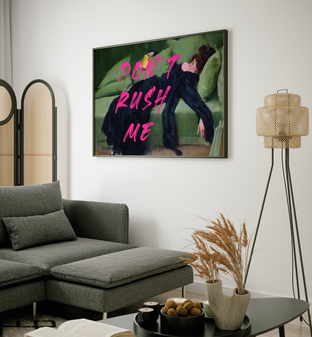 Dont Rush Me Vii by the Art Concept Altered Art Prints in Black Plain Frame placed on a wall beside a sofa