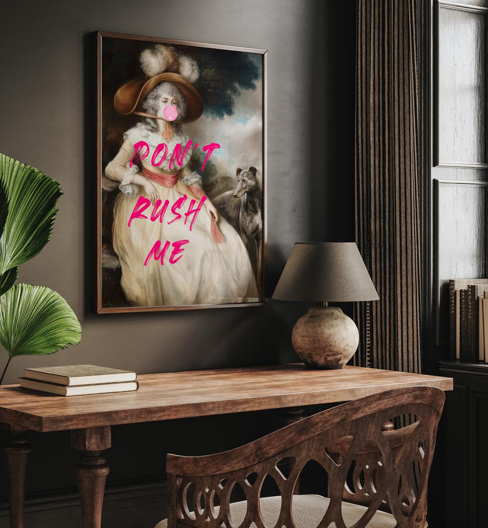 Dont Rush Me by the Art Concept Altered Art Prints in Oak Wood Plain Frame placed on a wall behind a study table