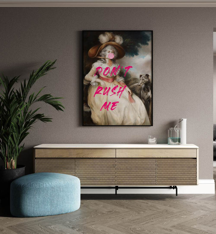 Dont Rush Me by the Art Concept Altered Art Prints in Black Plain Frame placed on a wall behind a console table