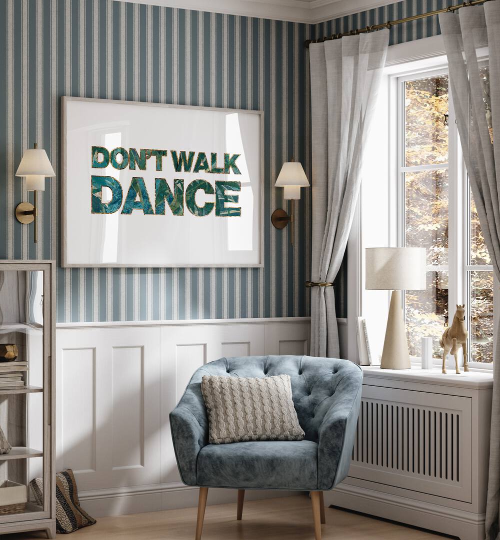 Dont Walk Dance By Sarah Manovski Quotes and Typography Poster in Oak Wood Plain Frame placed on a wall behind a sofa and beside a window