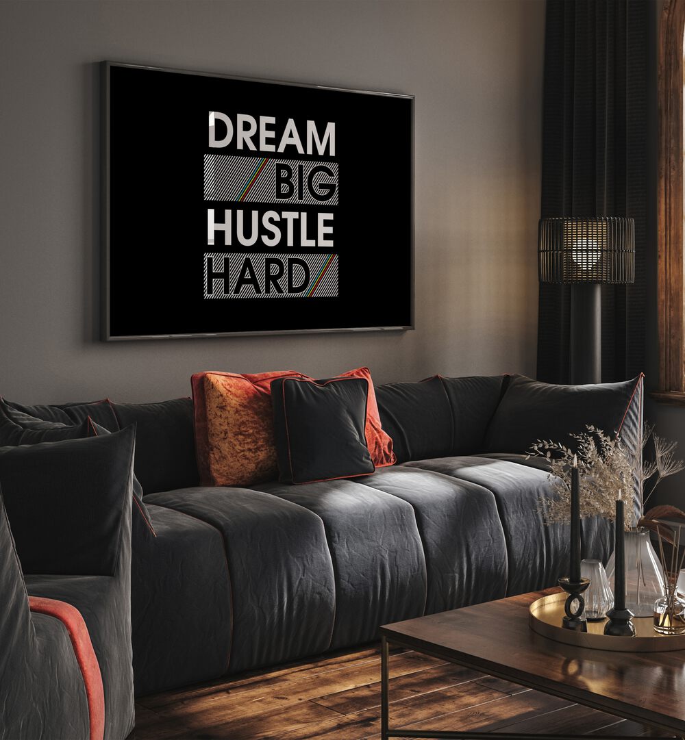 Dream Big Hustle Hard Quotes and Typography Posters in Black Plain Frame placed on a living room wall behind a sofa