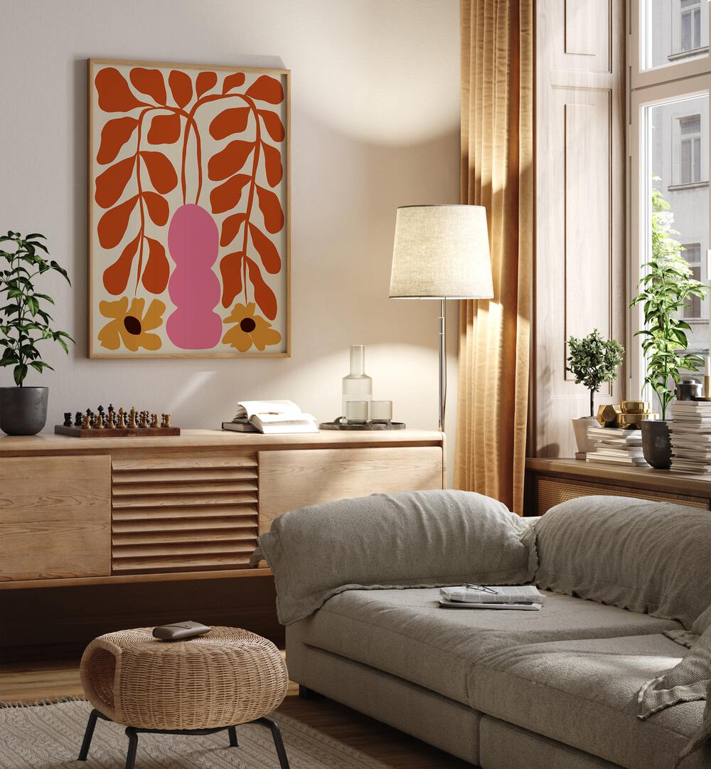 Dropping Orange Fern II By Miho Art Studio Botanical Art Prints Floral Paintings in Oak Wood Plain Frame placed on a Cream Colored Wall above a Console Table near a Beige Sofa in the Living Room