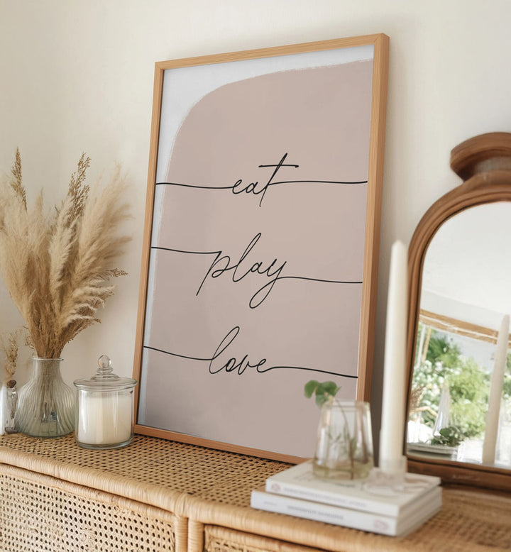 EAT PLAY LOVE , QUOTES minimalist blush typography poster on rattan dresser with candle