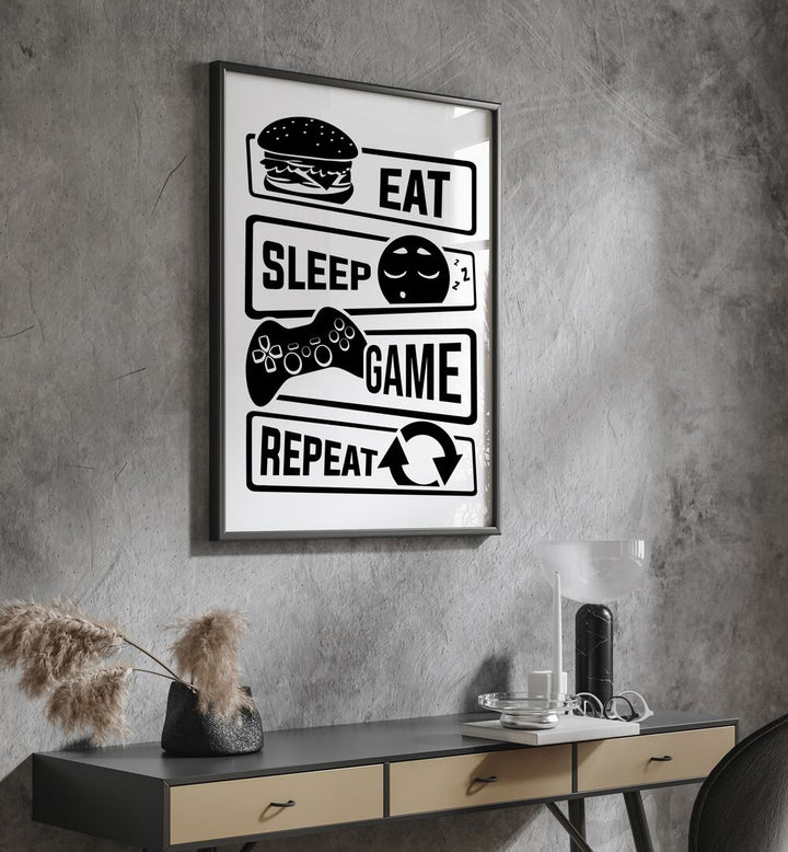 Eat Sleep Game Repeat III Gaming Art Painting Artwork in plain black frame above a black table on a grey wall