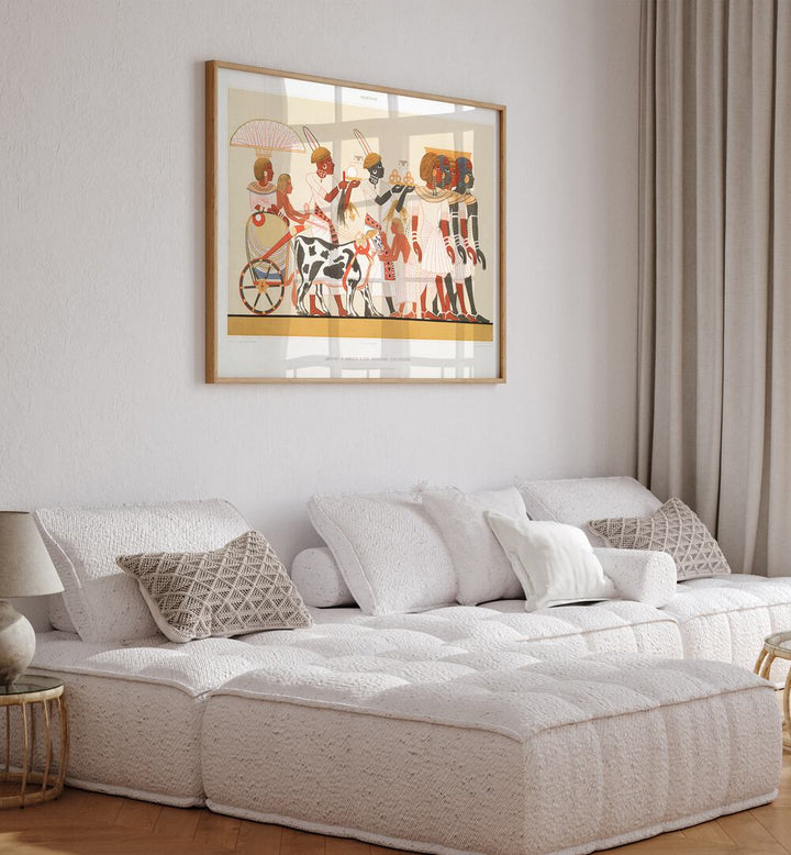 Ethiopian Princess Arrival Thebes Artwork Egyptian Cultural Art Painting Artwork in oakwood plain frame behind a sofa on a white wall