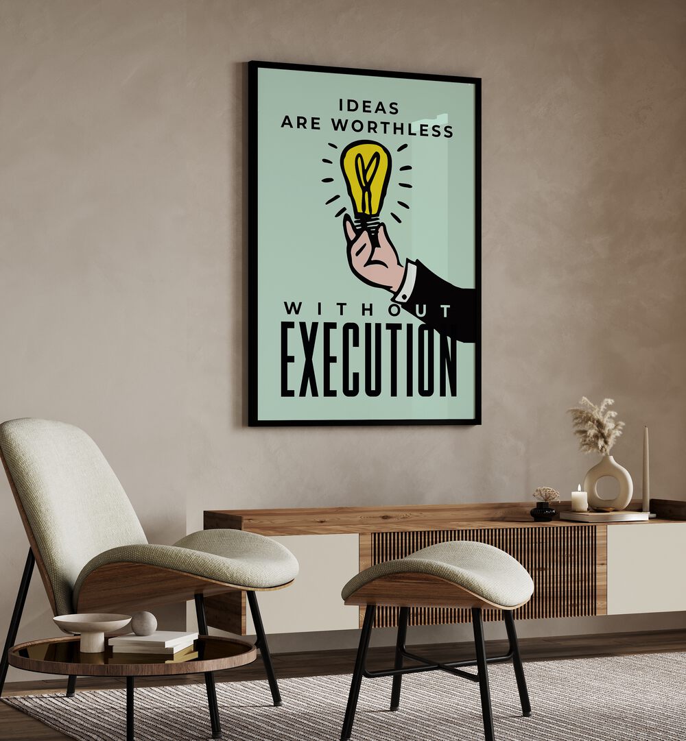 Execution Money Art Artwork in plain black frame anging on wall near white chair in living space