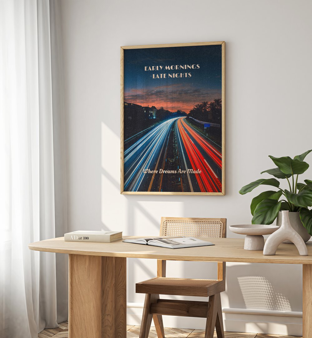 Early Mornings Late Nights II Quotes And Typography Posters in Oak Wood Plain Frame placed on a White Colored Wall near a Study Table in a Workspace in the Drawing Room