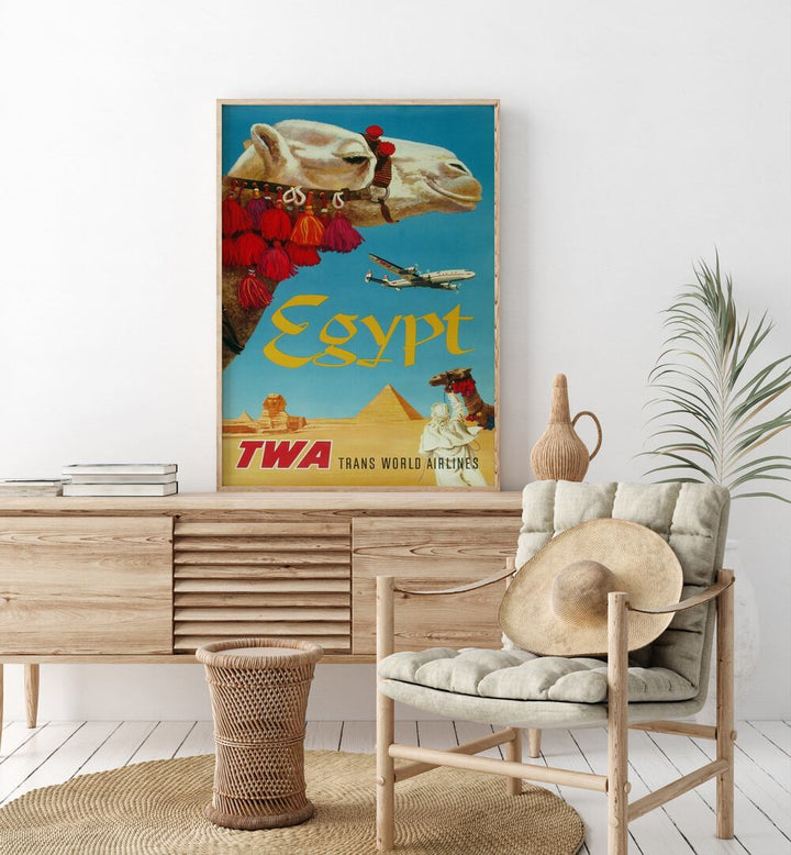 Egypt-Trans World Airlines  Retro Travel Posters in Oak Wood Plain Frame placed on a console table behind a chair