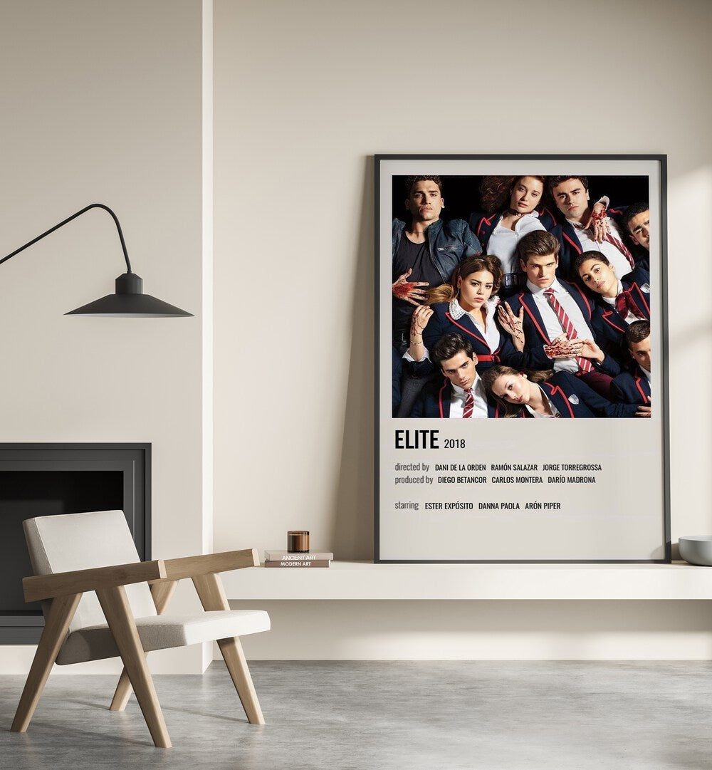 Elite 2018 Movie Posters in Black Plain Frame place on a wall behind a chair beside lamp