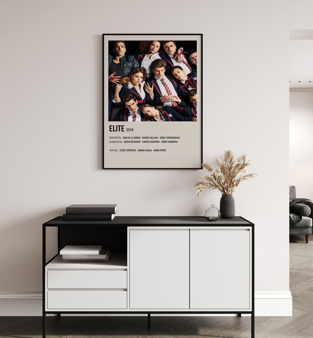 Elite 2018 Movie Posters in Black Plain Frame hanging on wall above console table