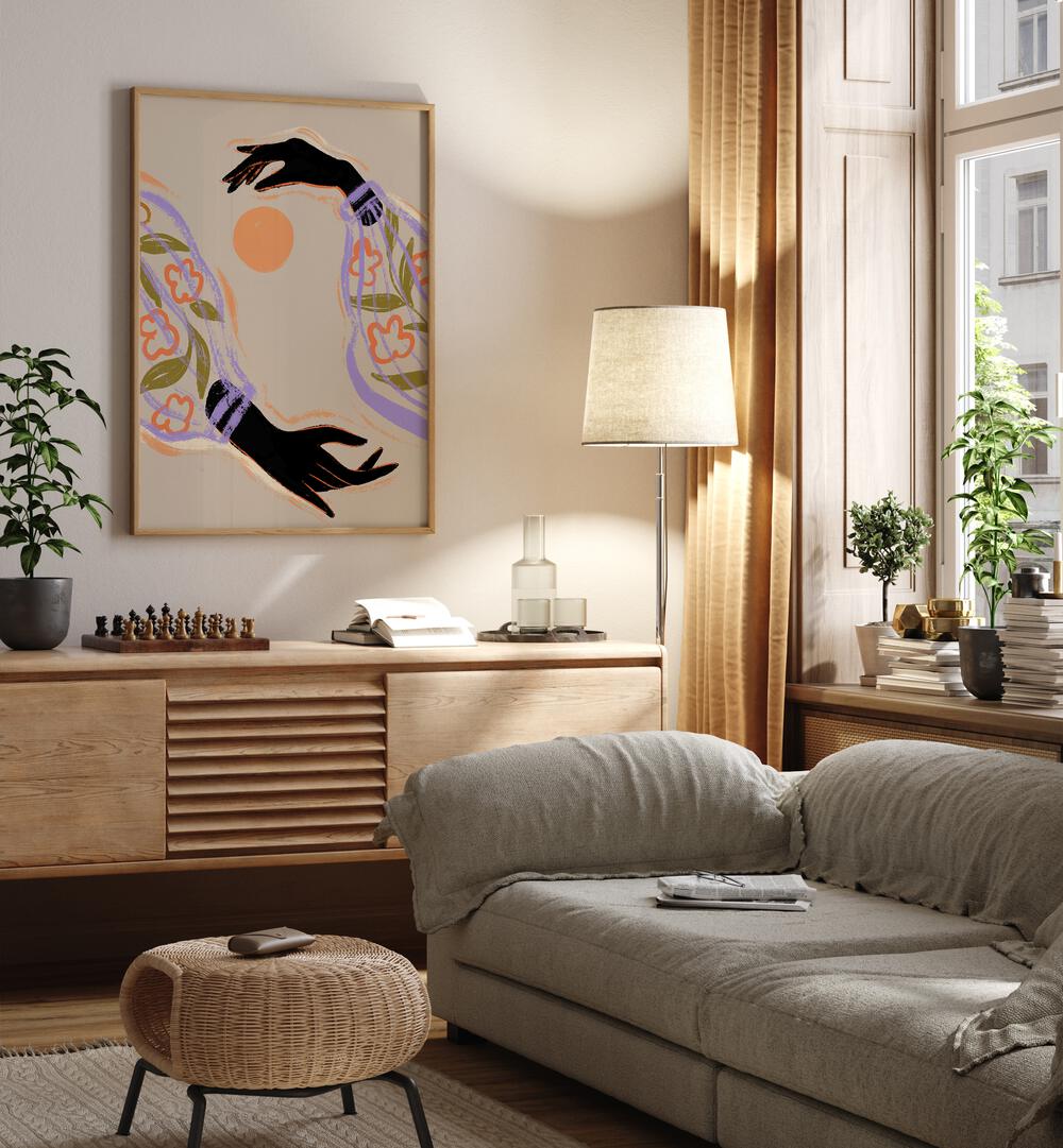 Embrace The Sun By Arty Guava Wall Art Prints in Oak Wood Plain Frame placed on a Cream Colored Wall above a Console Table near a Grey Sofa in the Living Room