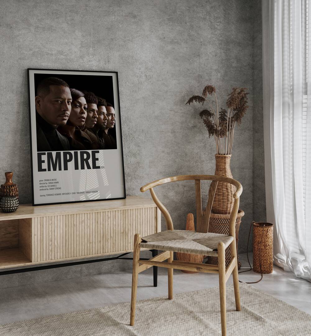 Empire 2015 II Movie Posters in Black Plain Frame placed on a table beside oakwood chair