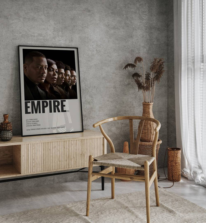 Empire 2015 II Movie Posters in Black Plain Frame placed on a table beside oakwood chair