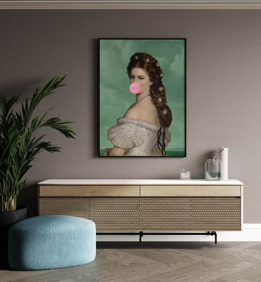 Empress Elisabeth Bubble Gum Portrait II By Grace Digital Art Co Altered Art Prints in Black Plain Frame placed on a wall behind a console table 