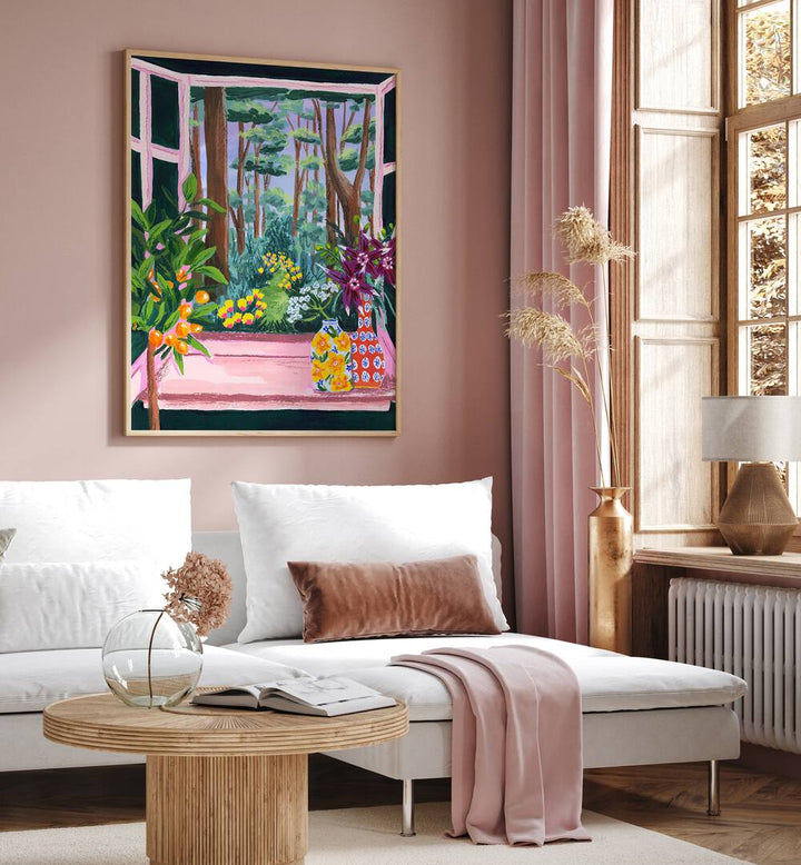 Enchanted Garden By Sarah Gesek Landscape Art Prints in Oak Wood Plain Frame placed on a living room wall beside a window and behind a sofa