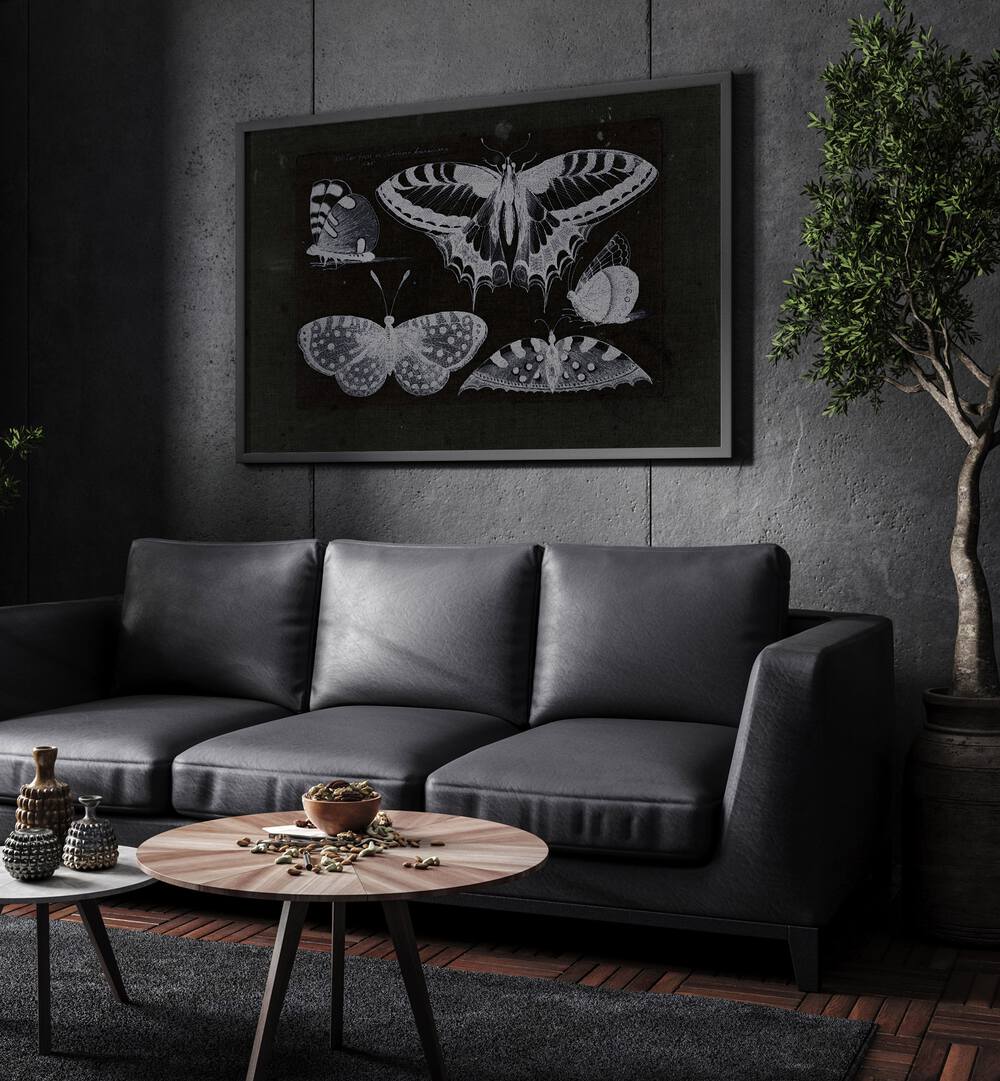 Ethereal Symphony Harmonizing With Butterfly Whispers Gothic Art Prints in Black Plain Frame hanging on a wall above black leather couch beside a plant.