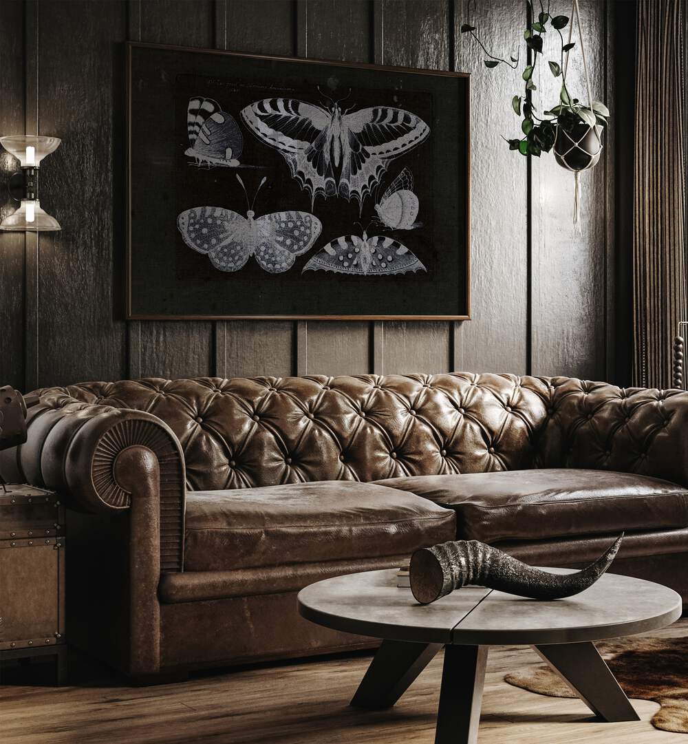 Ethereal Symphony Harmonizing With Butterfly Whispers Gothic Art Prints in Oak Wood Plain Frame hanging on a wall above brown leather couch beside a window