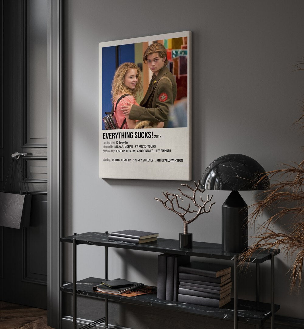 Everything Sucks 2018 I Movie Posters in Gallery Wrap placed on a wall behind a table and beside a door