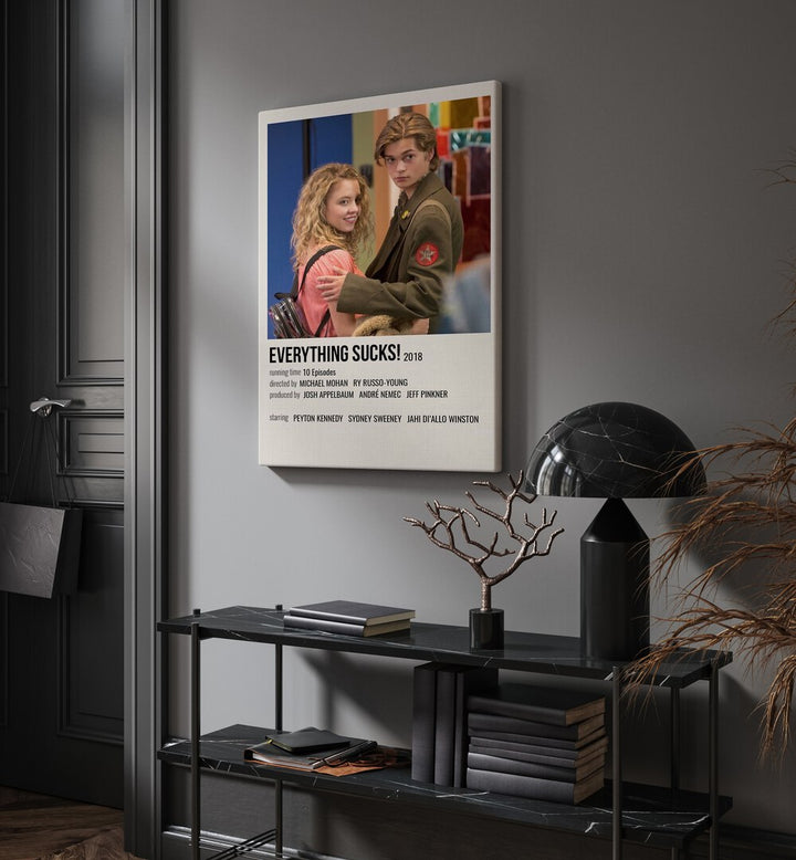 Everything Sucks 2018 I Movie Posters in Gallery Wrap placed on a wall behind a table and beside a door