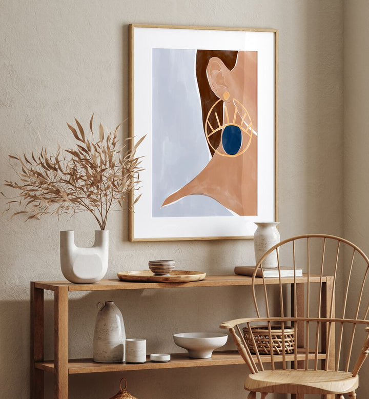 Evil Eye Earring By Ivy Green Women Illustration Paintings in Oak Wood Frame With Mount on a beige wall above a table