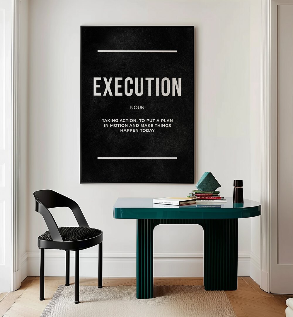 Execution II Quotes And Typography Posters in Black Plain Frame placed on a Cream Colored Wall near a Study Table in a Workspace in the Drawing Room