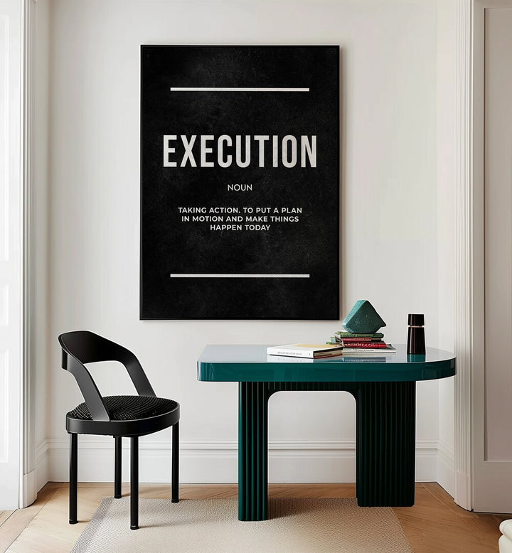 Execution II Quotes And Typography Posters in Black Plain Frame placed on a Cream Colored Wall near a Study Table in a Workspace in the Drawing Room