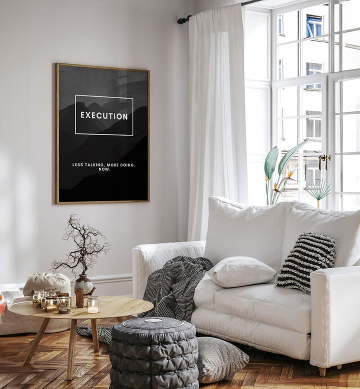Execution Quotes And Typography Posters in Oak Wood Plain Frame placed on a White Colored Wall near a White Sofa in the Living Room